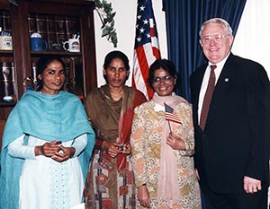 Joe Pitts standing with three women from Pakistan