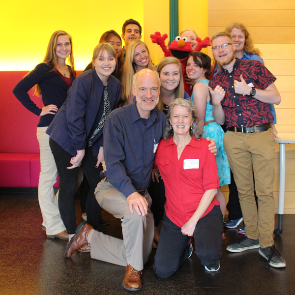Students and advisors with Elmo during a trip to Sesame Workshop.