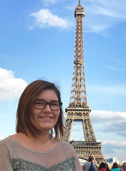 Student posing in front of Eiffel Tower