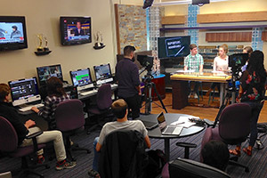 Students recording a news program