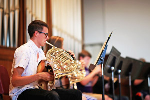 student playing french horn