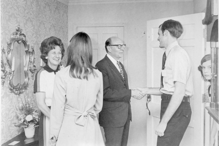 Dr. Dennis Kinlaw greeting visitors