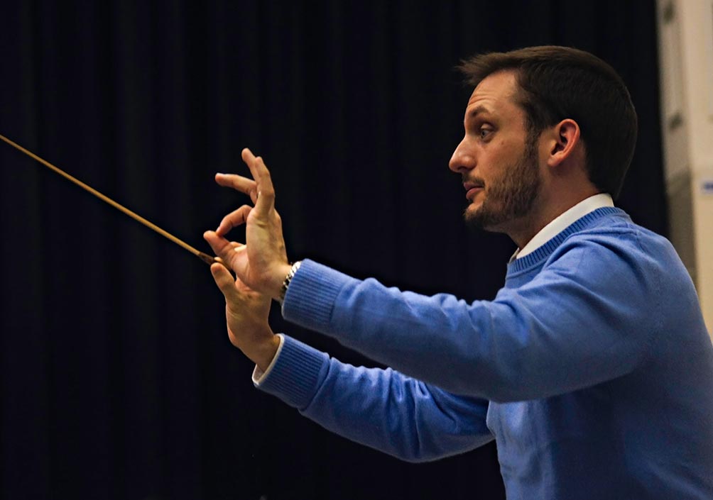 Prof. Nathan Miller directing the orchestra