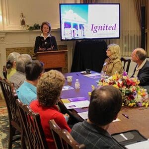 Dr. Gray speaking at a meeting