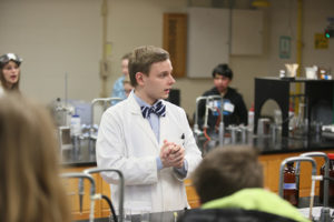 Chemistry student demonstrating in a lab