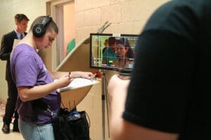 Student working on a film set