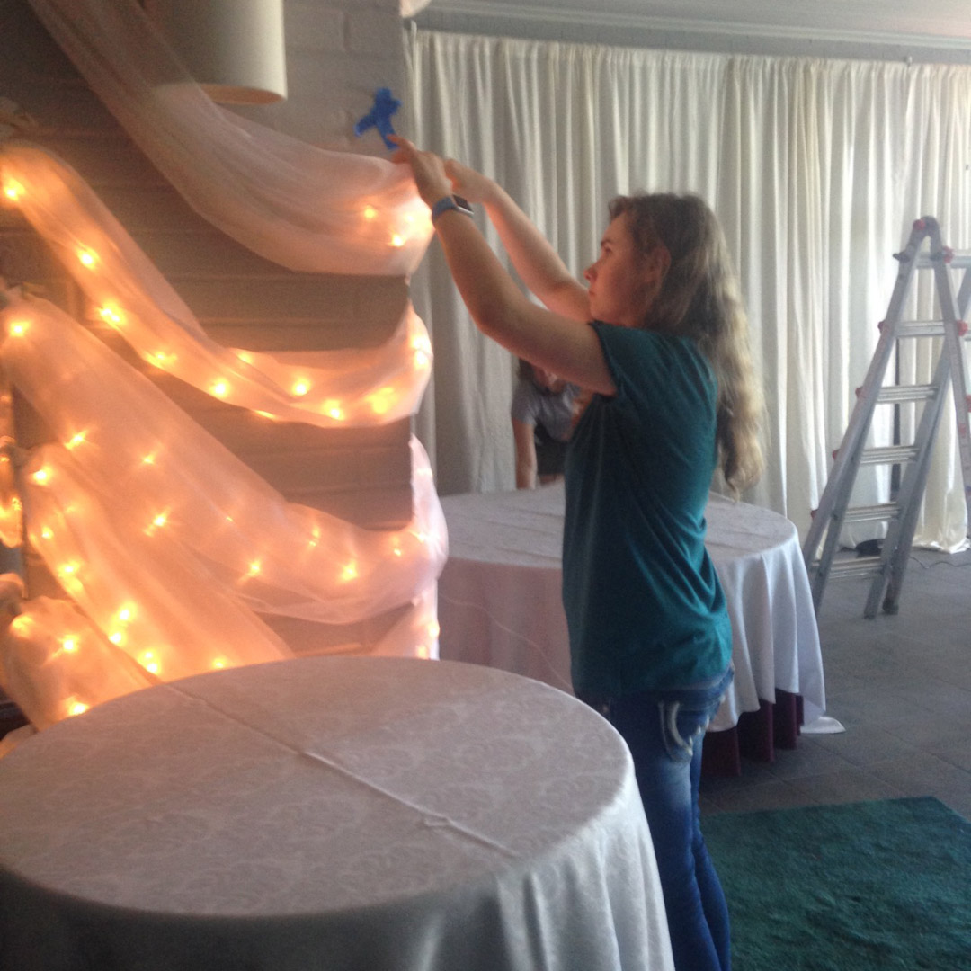 Student decorating a ballroom