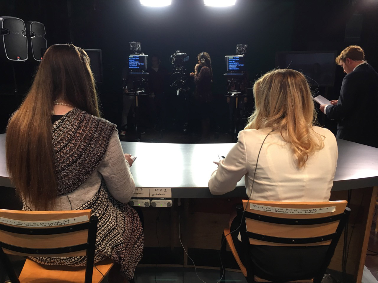 student presenters prepare for a news broadcast