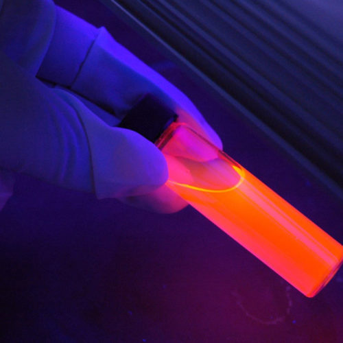 Glowing test tube revealing fingerprints