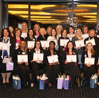 Educators posing with certificates