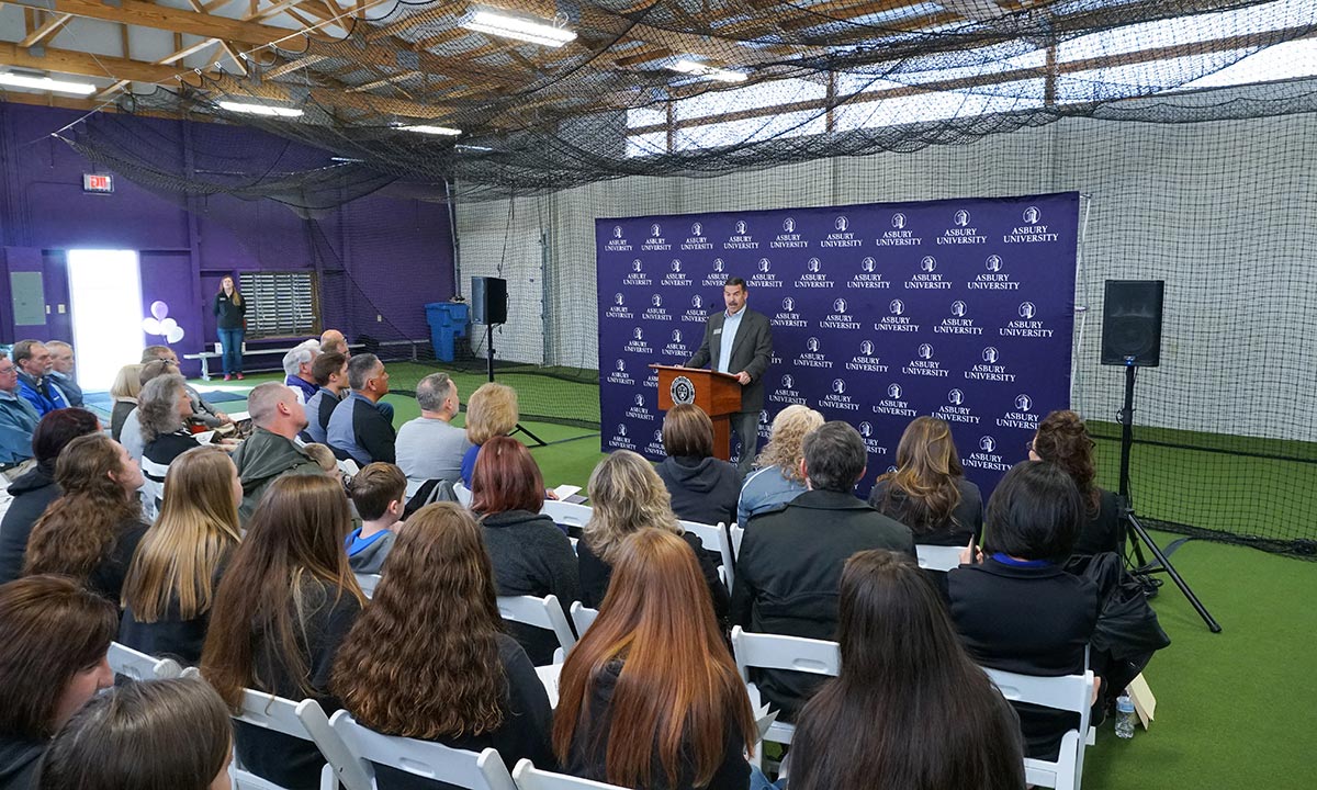person speaking at the dedication ceremony of the Bowdoin Athletic Practice Facility