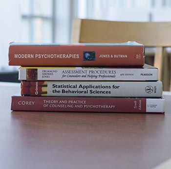 a stack of psychology textbooks