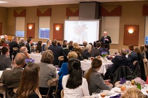 Howard Dayton speaks at a banquet