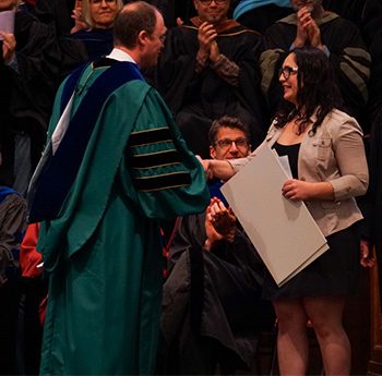 student receiving an award during a ceremony
