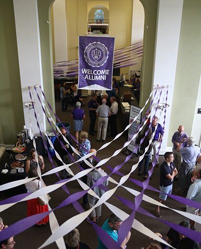room decorated with purple and white banners and ribbons