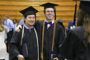 graduates smiling for the camera