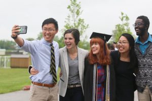 Graduates smiling for the camera