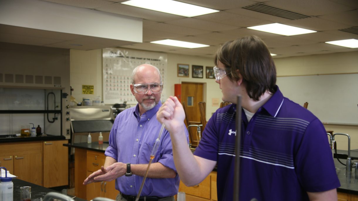 Dr. Branan working with a student in a chemistry lab