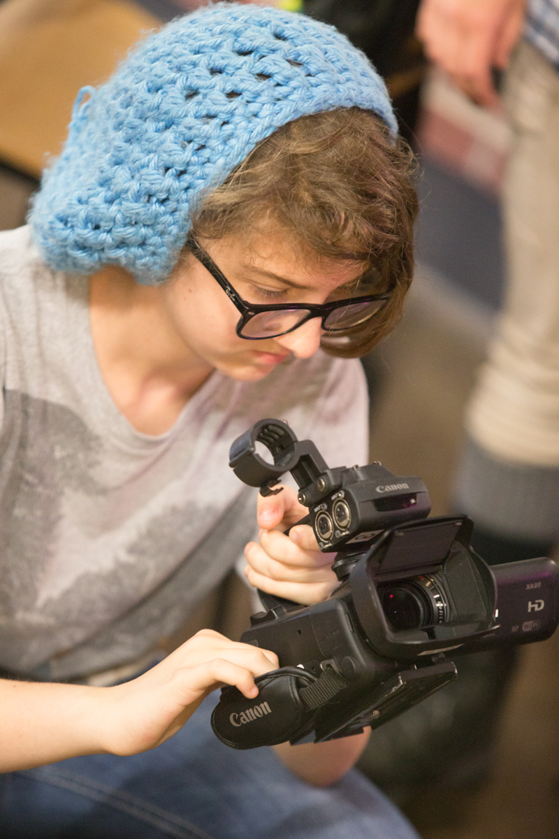 student using a video camera