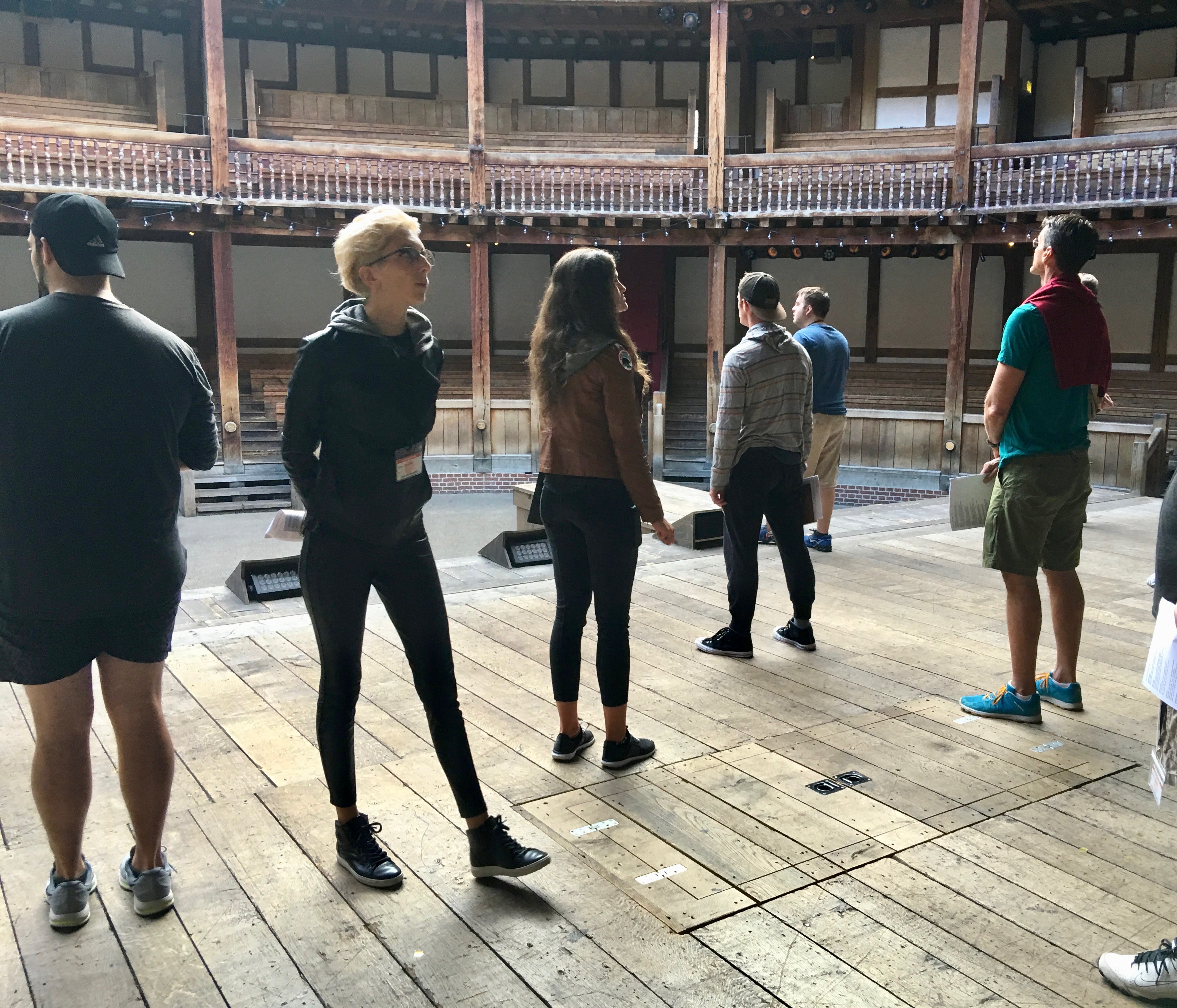 students standing on the stage of the Globe Theatre