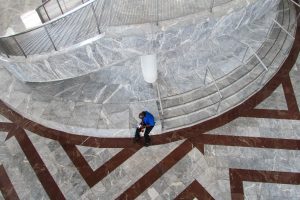 person sitting on marble steps