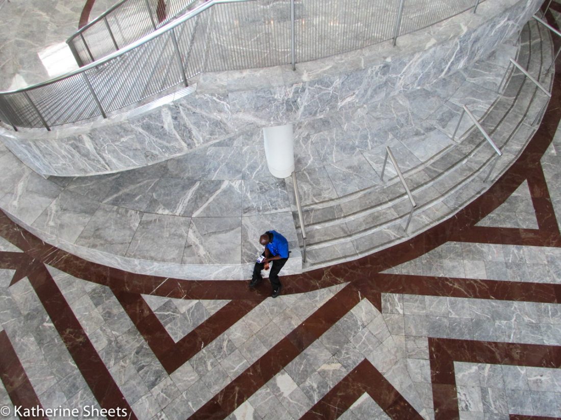 person sitting on marble steps
