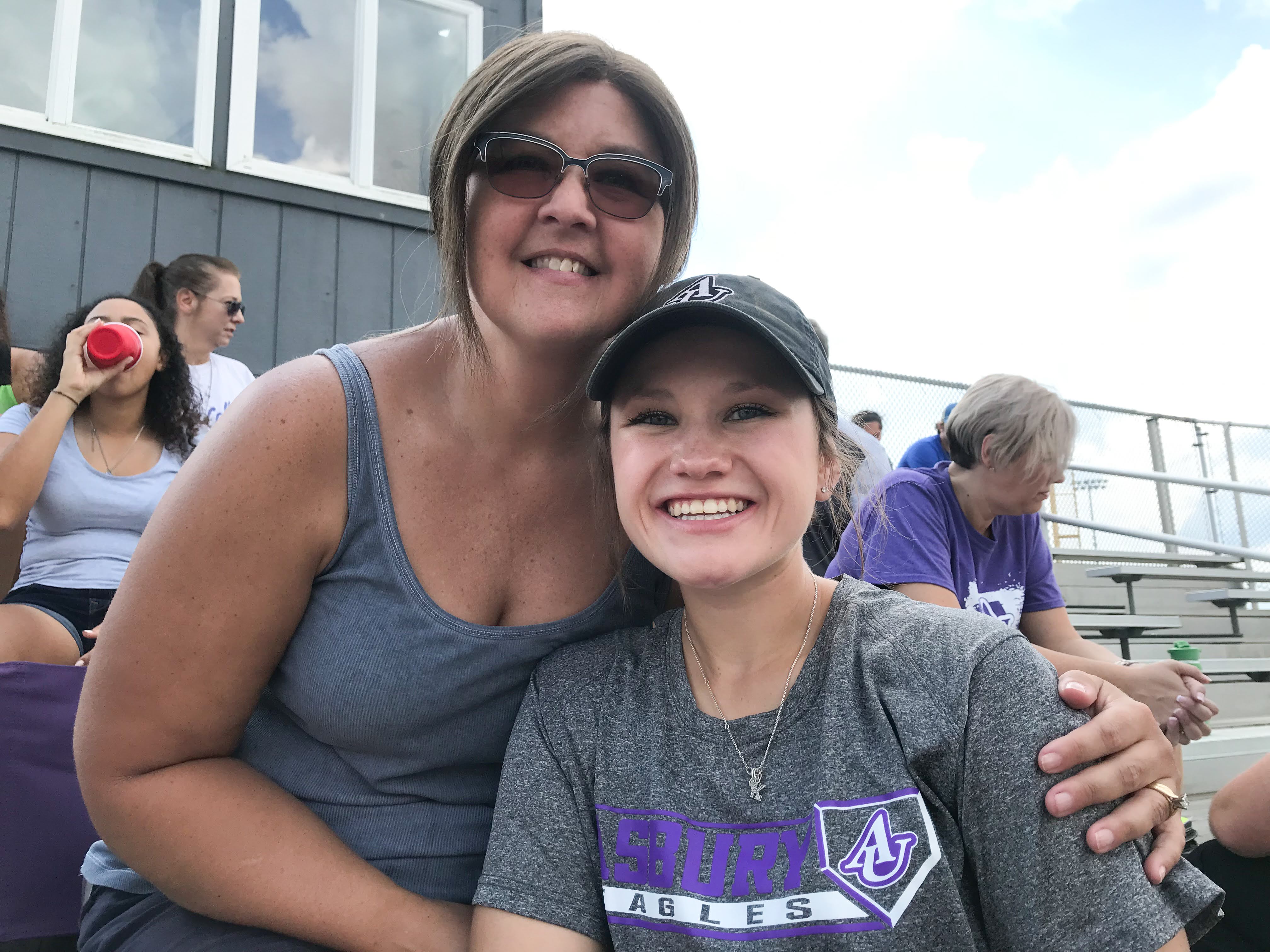 student and parent at a game