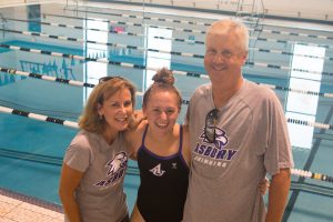parents and swim team member