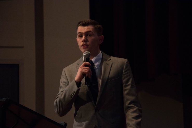 Student speaking at a conference