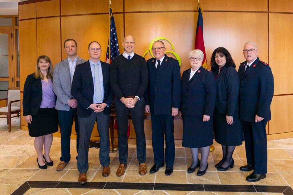 Officials and staff of Asbury University and The Salvation Army