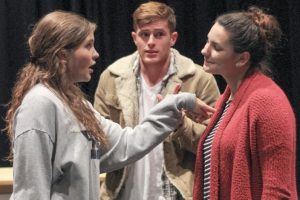 students acting in a play