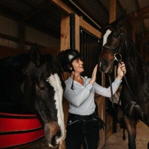 student with two horses