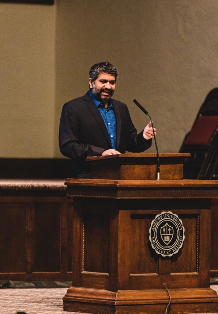 Dr. Praveen Sethupathy speaking in Hughes Auditorium