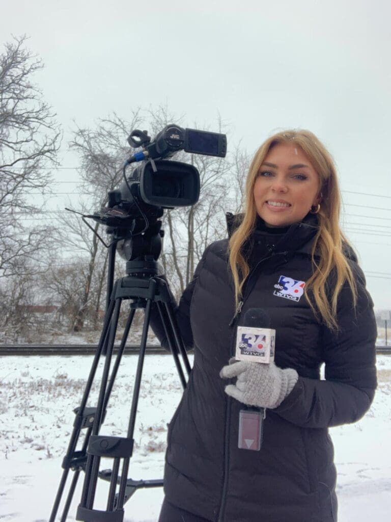 Journalism student making a newscast on location
